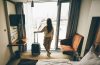 A female traveler in the hotel room