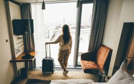 A female traveler in the hotel room